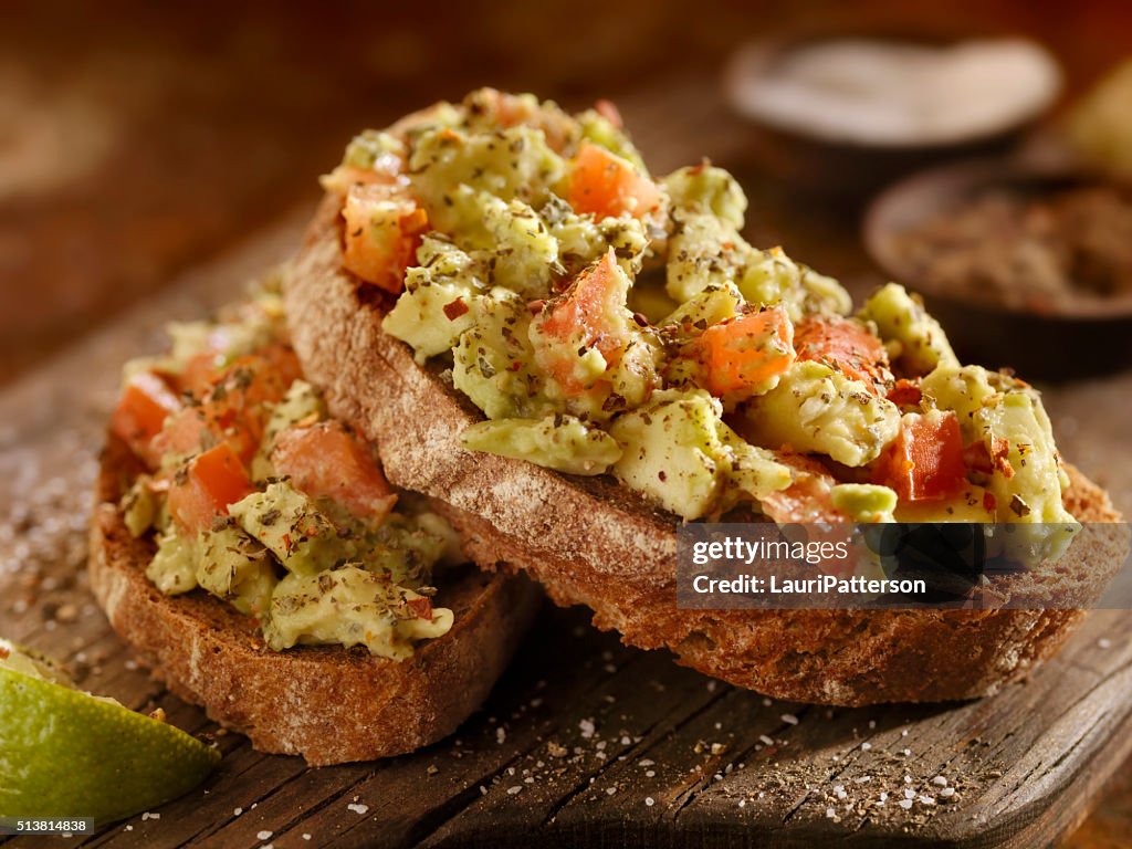 Avocado Toast with Tomatoes on Rye Bread