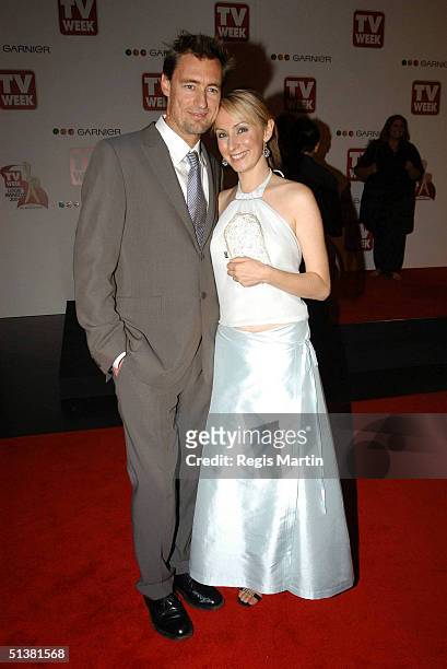 April 2004 - LISA McCUNE + husband TIM DISNEY arriving on the red carpet, for the 2004 TV Week Logie Awards. At the Crown Casino. Melbourne,...