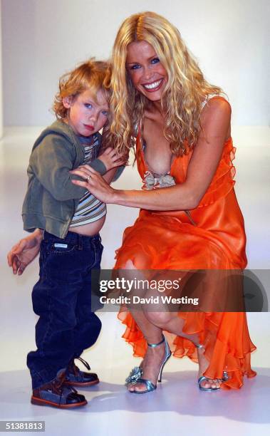 Melinda Messenger and one of her children attend the D&G AW04 children's fashion show in association with Vogue Bambini and Barnardo's, at Harrods...