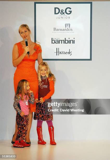 Tania Bryers and her children attend the D&G AW04 children's fashion show in association with Vogue Bambini and Barnardo's, at Harrods Knightsbridge...