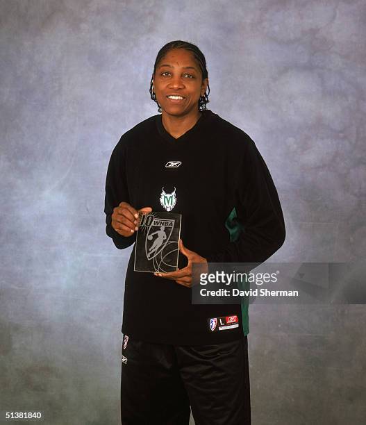 Teresa Edwards of the Minnesota Lynx poses for a portrait with her 2004 WNBA Sportsmanship Award prior to Game One of the 2004 Western Conference...
