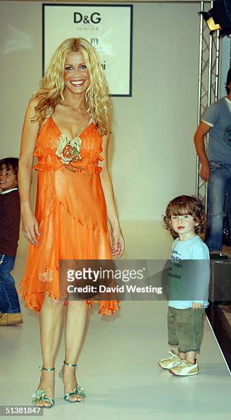 Melinda Messenger and one of her children attend the D&G AW04 children's fashion show in association with Vogue Bambini and Barnardo's, at Harrods...