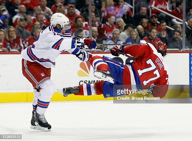 Eric Staal of the New York Rangers checks T.J. Oshie of the Washington Capitals during the second period at the Verizon Center on March 4, 2016 in...