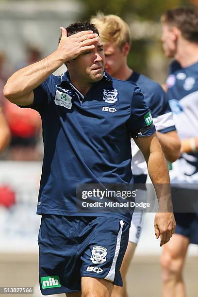 Cats head coach Chris Scott is seen after speaks to his players in a huddle before the warm up during the 2016 AFL NAB Challenge match between the...