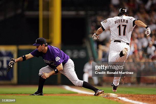 First baseman Todd Helton of the Colorado Rockies makes the out on Lance Berkman of the Houston Astros October 1, 2004 at Minute Maid Park in...