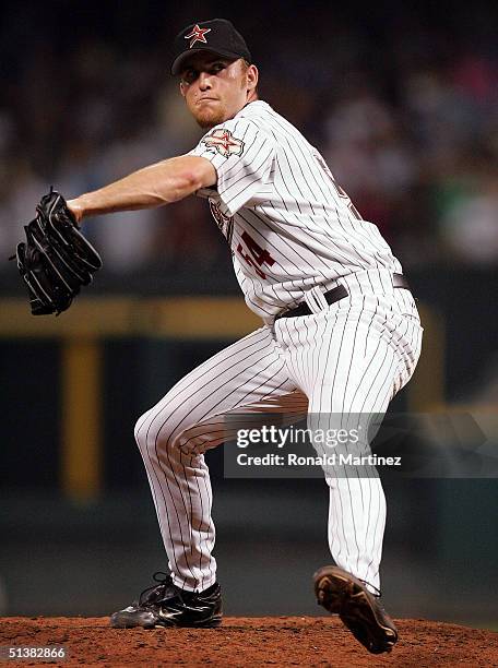 Closing pitcher Brad Lidge of the Houston Astros throws against the Colorado Rockies October 1, 2004 at Minute Maid Park in Houston, Texas. The...