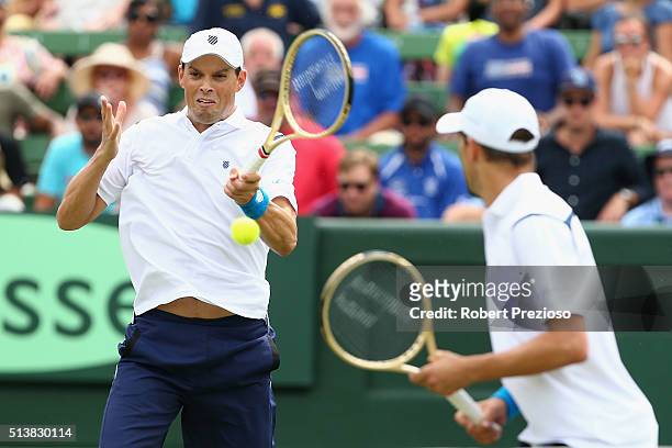Bob Bryan of the United States and Mike Bryan of the United States in action in Men's doubles match against Lleyton Hewitt of Australia and John...