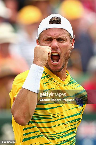 Lleyton Hewitt of Australia reacts in Men's doubles match against Mike Bryan and Bob Bryan of the United States during the Davis Cup tie between...