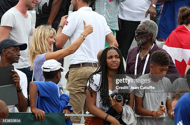 Isabelle Camus, wife of Yannick Noah reacts with Zacharie Noah, father of Yannick Noah during day 1 of the Davis Cup World Group first round tie...