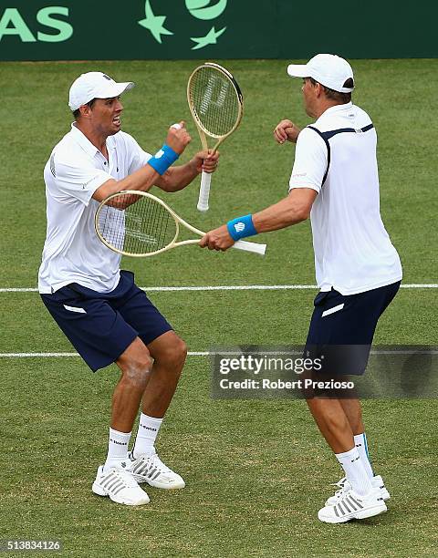 Bob Bryan of the United States and Mike Bryan of the United States celebrate winning the Men's doubles match against Lleyton Hewitt of Australia and...