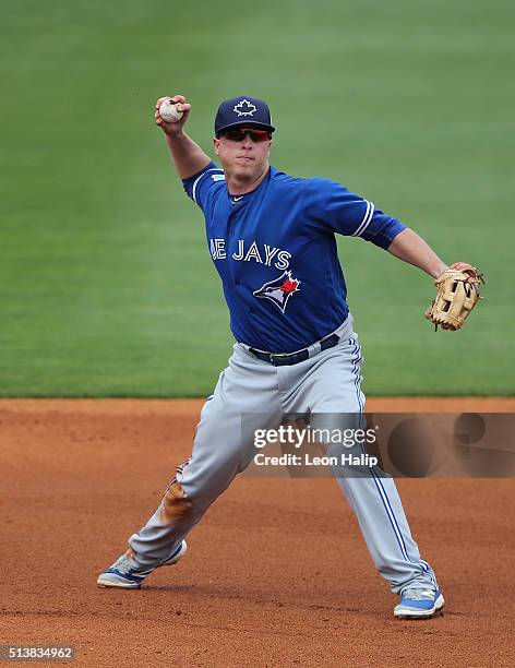 Matt Dominguez of the Toronto Blue Jays fields the ground ball during the Spring Training Game against the Pittsburgh Pirates on March 3, 2016 at...