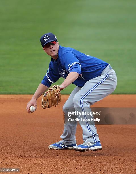 Matt Dominguez of the Toronto Blue Jays fields the ground ball during the Spring Training Game against the Pittsburgh Pirates on March 3, 2016 at...