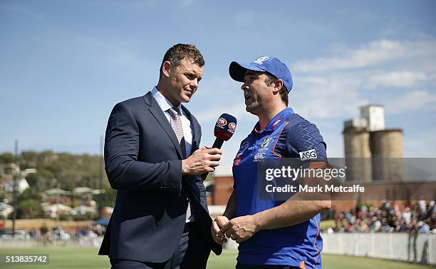 Cameron Mooney interviews Kangaroos head coach Brad Scott before the 2016 AFL NAB Challenge match between the North Melbourne Kangaroos and the...