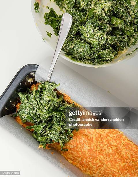 second layer of spinach batter above layer with carrot batter. - calcium scoring stock pictures, royalty-free photos & images