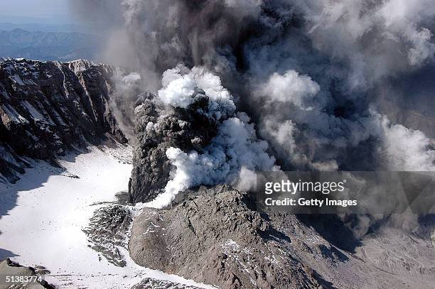 Smoke and ash is seen rising from the crater of Mount St Helens in this handout photo provided by the U.S. Geological Survey as it erupts October 1,...