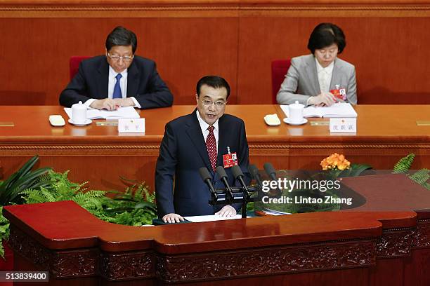 Chinese Premier Li Keqiang delivers his report during the opening ceremony of the National People's Congress in the Great Hall of the People on March...