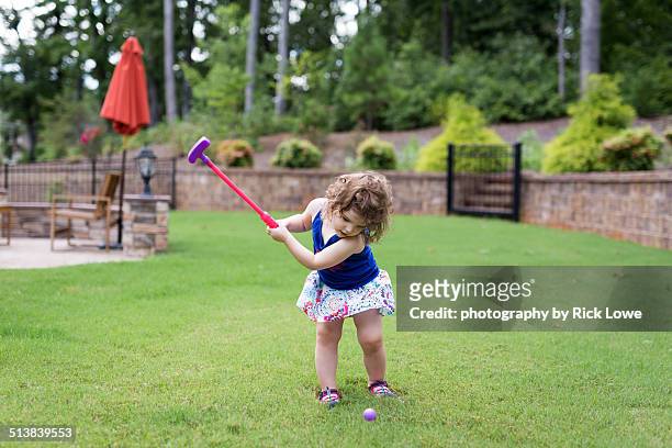 golfing in backyard - golf short iron stock pictures, royalty-free photos & images
