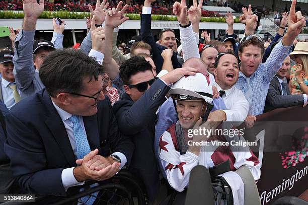 Mark Zahra celebrates with owners after riding Palentino to win Race 7, the Australian Guineas during Melbourne Racing at Flemington Racecourse on...