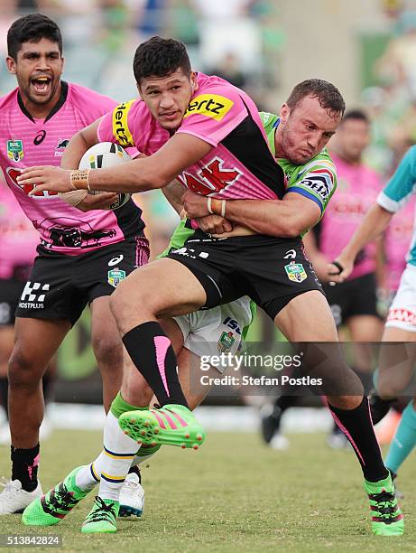 Dallin Watene-Zelezniak of the Panthers is tackled during the round one NRL match between the Canberra Raiders and the Penrith Panthers at GIO...