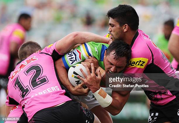 Jordan Rapana of the Raiders is tackled during the round one NRL match between the Canberra Raiders and the Penrith Panthers at GIO Stadium on March...
