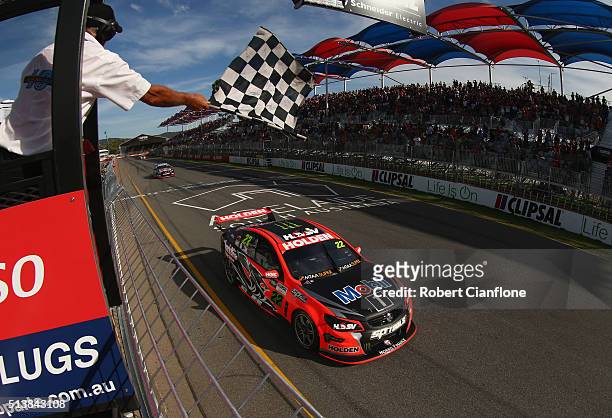 James Courtney driving the Holden Racing Team Holden takes the chequered flag to win race two for the V8 Supercars Clipsal 500 at Adelaide Street...
