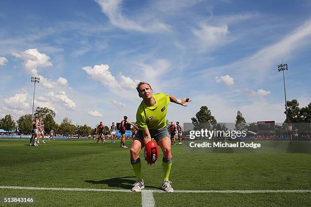 Boundary umpire throws the ball back into play during the 2016 AFL NAB Challenge match between the Essendon Bombers and the Geelong Cats at Deakin...