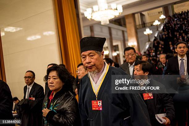 Delegates leave the Great Hall of the People at the end of the opening ceremony of the National People's Congress in Beijing on March 5, 2016. Chinas...