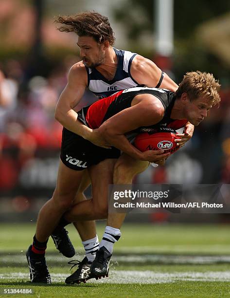 Will Hams of the Bombers and Josh Cowan of the Cats compete for the ball during the 2016 NAB Challenge match between the Essendon Bombers and the...