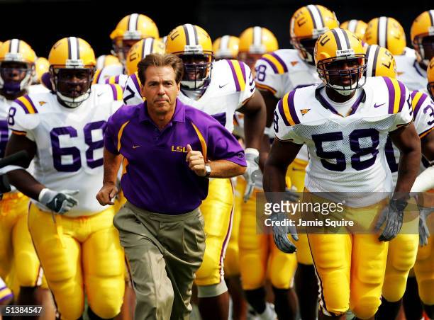 Head coach Nick Saban of the LSU Tigers leads his team out of the locker room prior to the start of the game against the Georgia Bulldogs at Sanford...