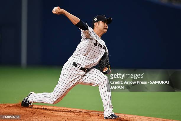 Pitcher Tomoyuki Sugano of Japan delivers a pitch in the top of first inning during the international friendly match between Japan and Chinese Taipei...