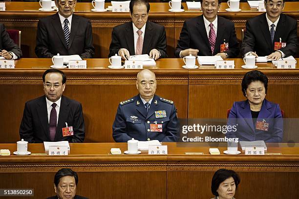 Sun Zhengcai, Chinese Communist Party secretary of Chongqing, left, Xu Qiliang, vice chairman of China's Central Military Commission, center, and Liu...