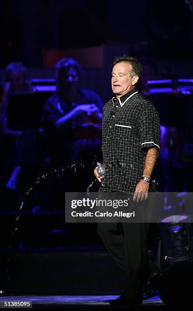 Actor Robin Williams performs on stage during the Andre Agassi Charitable Foundations 9th Annual "Grand Slam for Children" concert benefit at the MGM...