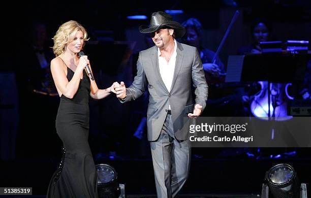 Singers Faith Hill and Tim McGraw performs on stage during the Andre Agassi Charitable Foundations 9th Annual "Grand Slam for Children" concert...