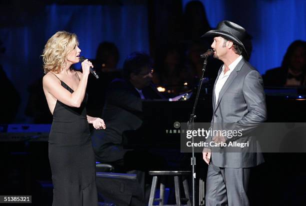 Singers Faith Hill and Tim McGraw performs on stage during the Andre Agassi Charitable Foundations 9th Annual "Grand Slam for Children" concert...