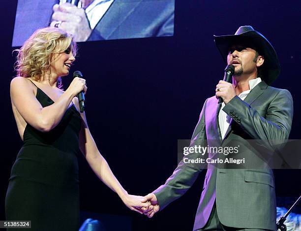 Singers Faith Hill and Tim McGraw performs on stage during the Andre Agassi Charitable Foundations 9th Annual "Grand Slam for Children" concert...