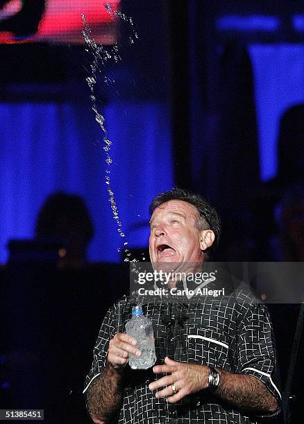 Actor Robin Williams performs on stage during the Andre Agassi Charitable Foundations 9th Annual "Grand Slam for Children" concert benefit at the MGM...