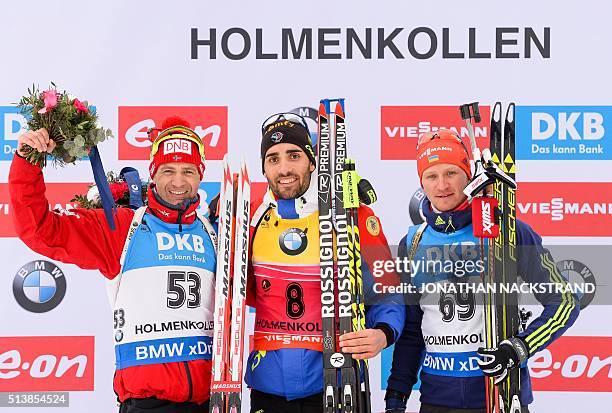 First placed Martin Fourcade of France celebrates with seconded place Ole Einar Bjoerndalen of Norway and third placed Serhij Semenov of Ukraine,...
