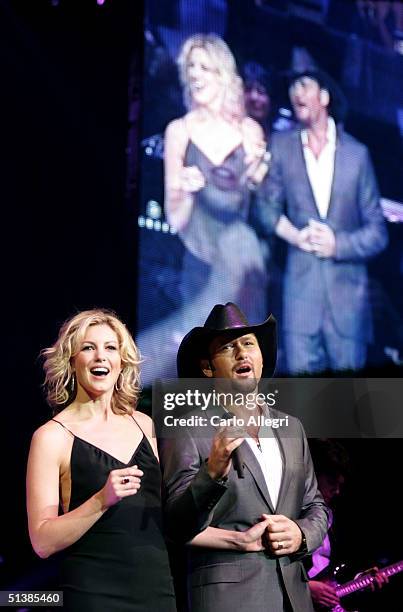 Singers Faith Hill and Tim McGraw perform on stage during the Andre Agassi Charitable Foundations 9th Annual "Grand Slam for Children" concert...