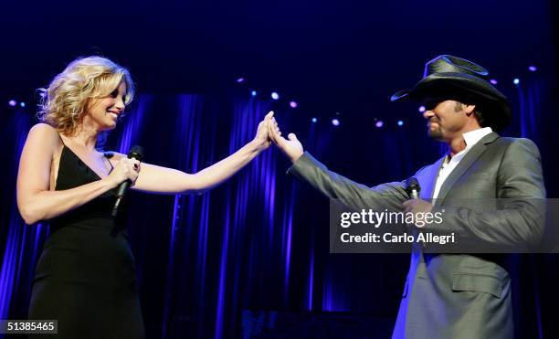 Singers Faith Hill and Tim McGraw perform on stage during the Andre Agassi Charitable Foundations 9th Annual "Grand Slam for Children" concert...