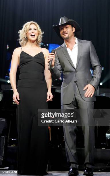 Singers Faith Hill and Tim McGraw perform on stage during the Andre Agassi Charitable Foundations 9th Annual "Grand Slam for Children" concert...
