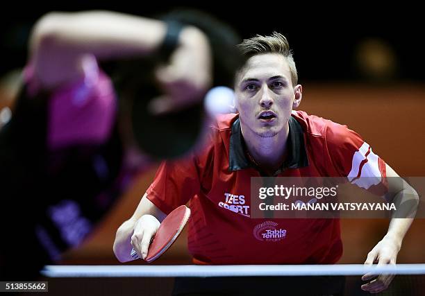 Liam Pitchford of England prepares to return a serve from Maharu Yoshimura of Japan during their men's singles semi-final match of the 2016 World...