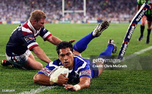 Matt Utai of the Bulldogs dives over for a try during the NRL Grand Final between the Sydney Roosters and the Bulldogs held at Telstra Stadium,...