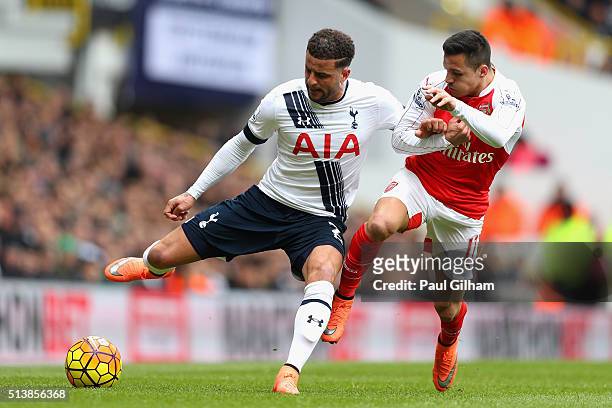 Kyle Walker of Tottenham Hotspur and Alexis Sanchez of Arsenal compete for the ball during the Barclays Premier League match between Tottenham...