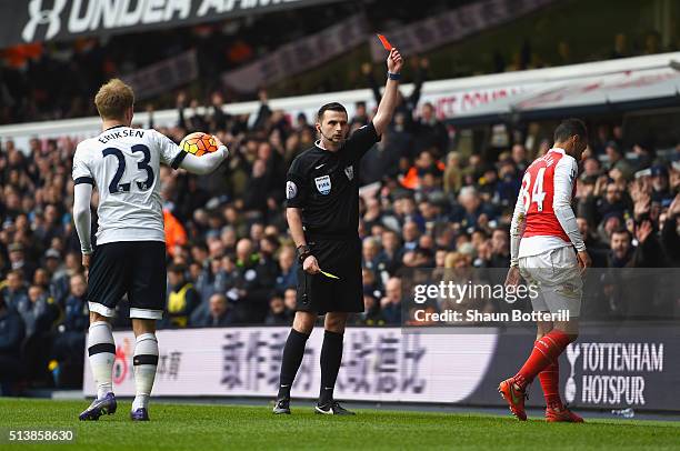 Francis Coquelin of Arsenal is shown a red card by referee Michael Oliver during the Barclays Premier League match between Tottenham Hotspur and...