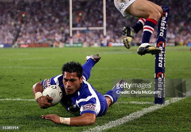Matt Utai of the Bulldogs dives over for a try during the NRL Grand Final between the Sydney Roosters and the Bulldogs held at Telstra Stadium,...