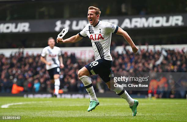 Harry Kane of Tottenham Hotspur scores his team's second goal during the Barclays Premier League match between Tottenham Hotspur and Arsenal at White...