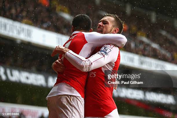 Alexis Sanchez of Arsenal celebrates scoring his team's second goal with his team mate Aaron Ramsey during the Barclays Premier League match between...