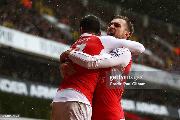 Alexis Sanchez of Arsenal celebrates scoring his team's second goal with his team mate Aaron Ramsey during the Barclays Premier League match between...