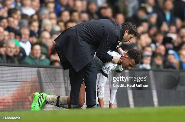 Mauricio Pochettino manager of Tottenham Hotspur talks to Dele Alli of Tottenham Hotspur during the Barclays Premier League match between Tottenham...