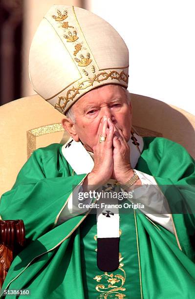 Pope John Paul II sits during the beatification ceremony held in St. Peter's Square October 3 , 2004 in Vatican City. Pope John Paul II named five...